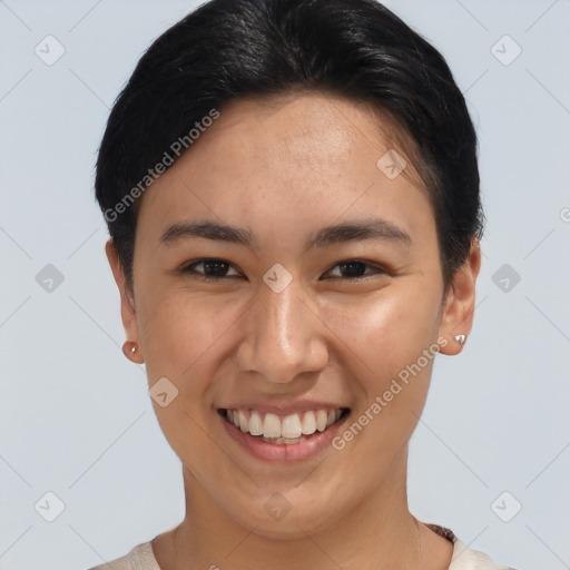 Joyful asian young-adult female with short  brown hair and brown eyes