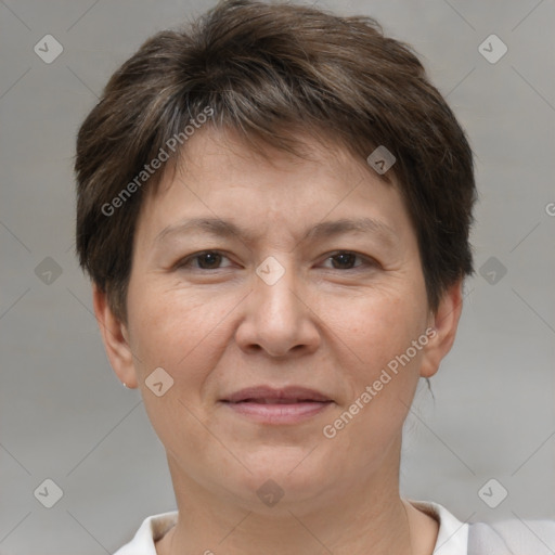 Joyful white adult female with short  brown hair and brown eyes