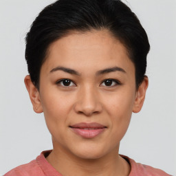 Joyful asian young-adult female with short  black hair and brown eyes