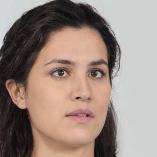 Neutral white young-adult female with long  brown hair and brown eyes