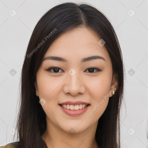 Joyful asian young-adult female with long  brown hair and brown eyes