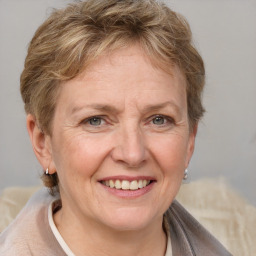 Joyful white adult female with short  brown hair and grey eyes