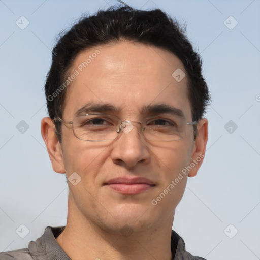 Joyful white adult male with short  brown hair and brown eyes