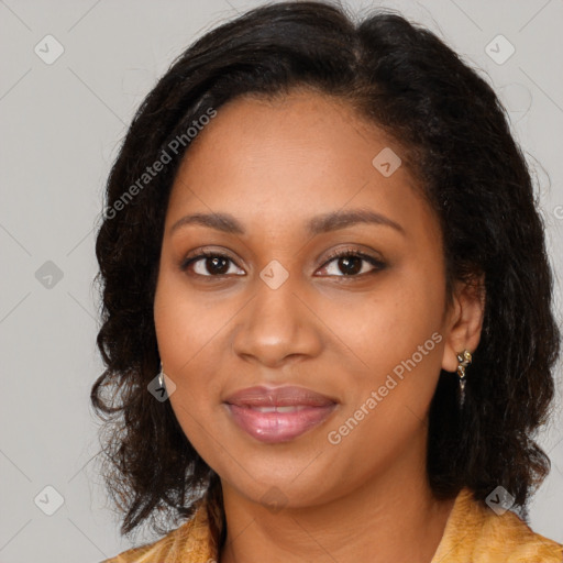 Joyful black young-adult female with long  brown hair and brown eyes