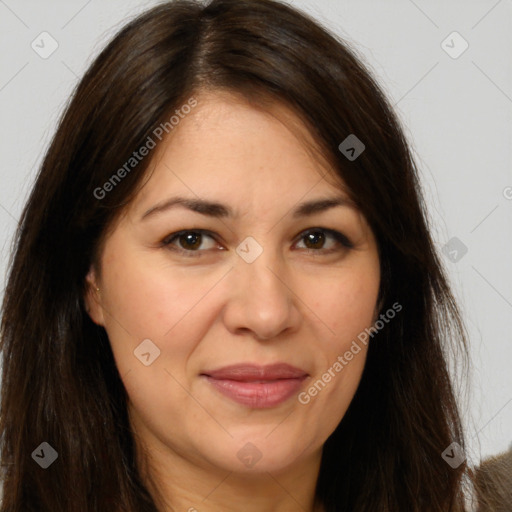 Joyful white adult female with long  brown hair and brown eyes