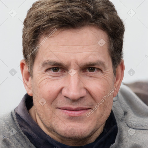 Joyful white adult male with short  brown hair and grey eyes