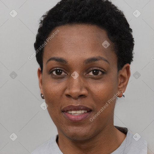 Joyful black young-adult female with short  black hair and brown eyes