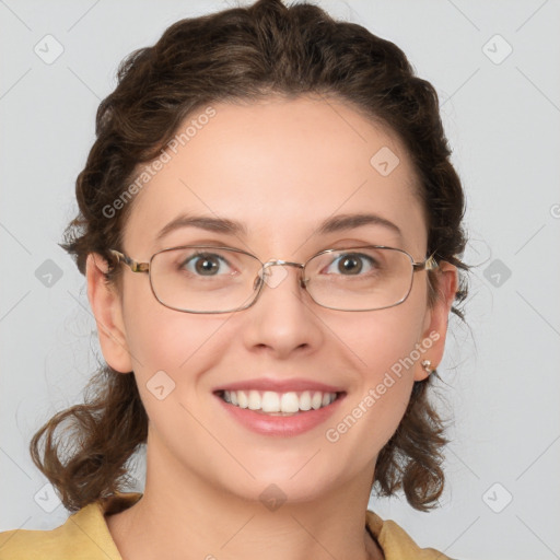 Joyful white young-adult female with medium  brown hair and green eyes