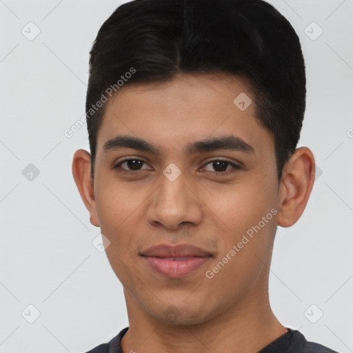 Joyful latino young-adult male with short  black hair and brown eyes