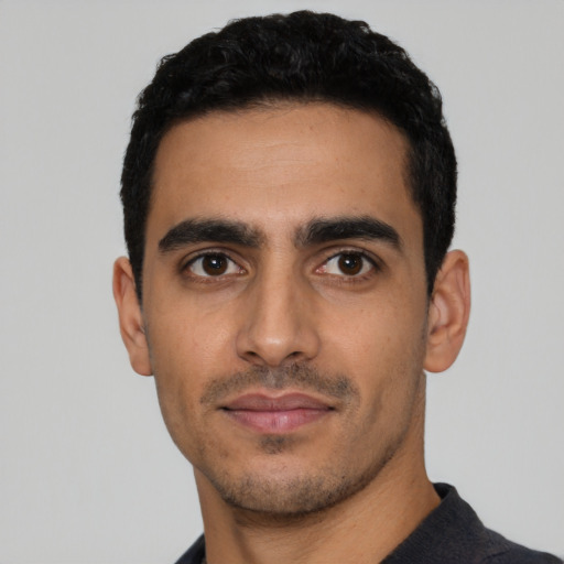 Neutral latino young-adult male with short  black hair and brown eyes