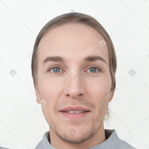 Joyful white young-adult male with short  brown hair and grey eyes