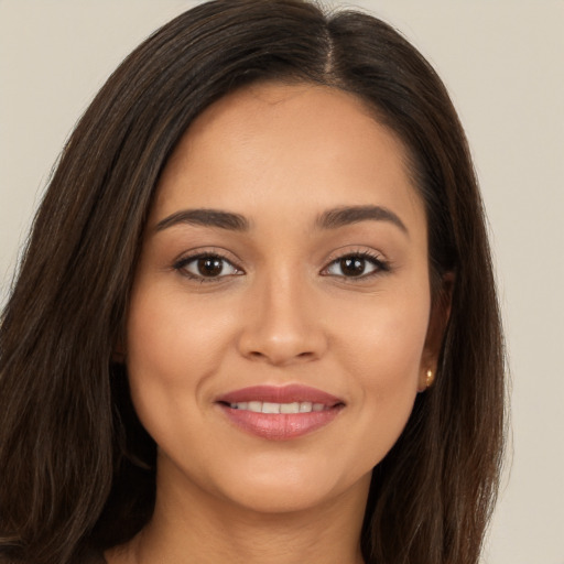 Joyful white young-adult female with long  brown hair and brown eyes