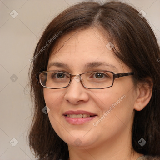 Joyful white adult female with medium  brown hair and brown eyes