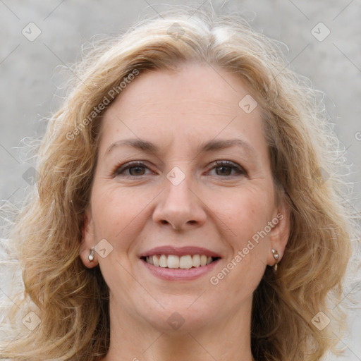 Joyful white adult female with medium  brown hair and grey eyes