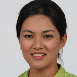 Joyful asian young-adult female with short  brown hair and brown eyes