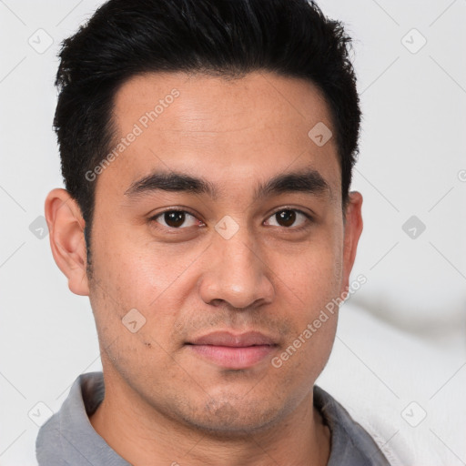 Joyful white young-adult male with short  black hair and brown eyes