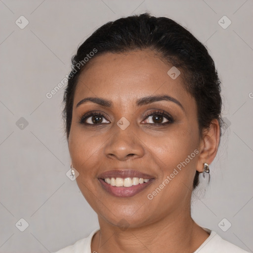 Joyful black young-adult female with medium  brown hair and brown eyes