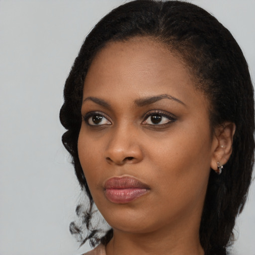 Neutral black young-adult female with medium  black hair and brown eyes