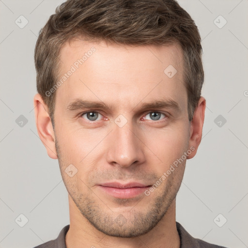 Neutral white young-adult male with short  brown hair and grey eyes