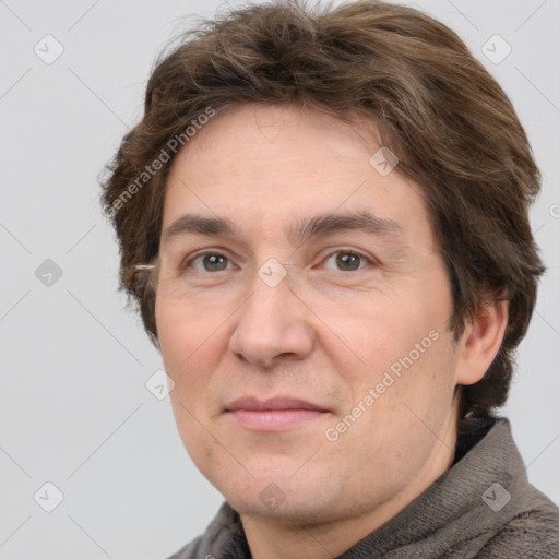 Joyful white adult male with short  brown hair and grey eyes