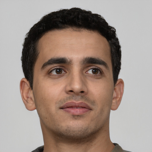 Neutral latino young-adult male with short  brown hair and brown eyes