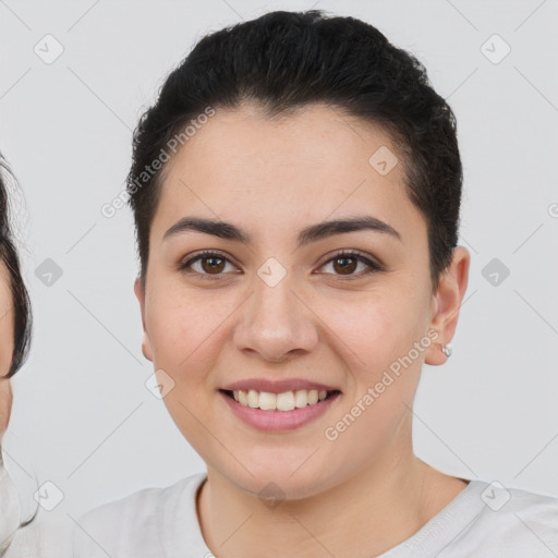 Joyful white young-adult female with short  black hair and brown eyes