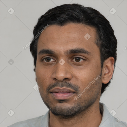 Neutral black young-adult male with short  black hair and brown eyes