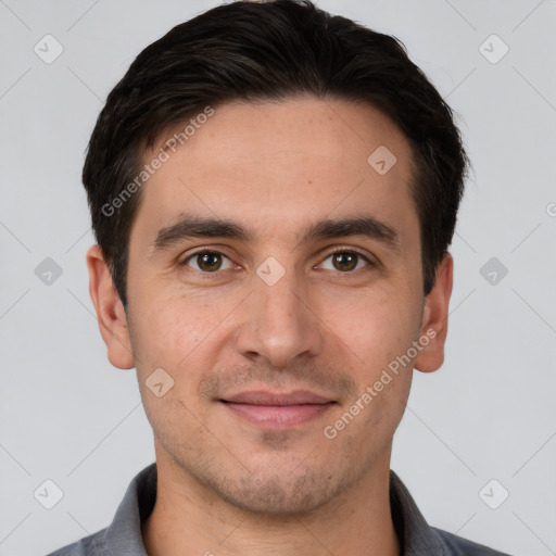 Joyful white young-adult male with short  brown hair and brown eyes