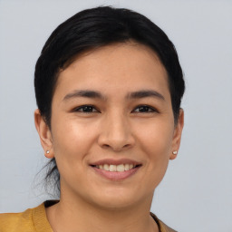 Joyful asian young-adult female with short  black hair and brown eyes