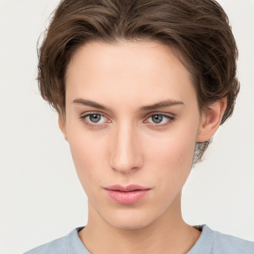 Neutral white young-adult female with short  brown hair and brown eyes