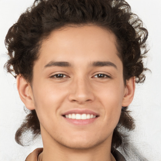 Joyful white young-adult male with medium  brown hair and brown eyes