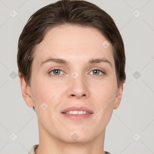 Joyful white young-adult female with short  brown hair and grey eyes