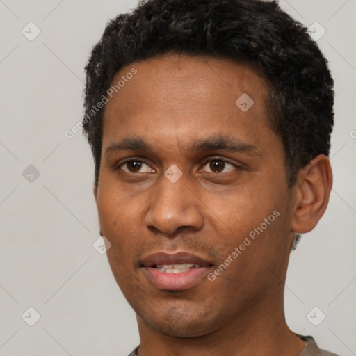 Joyful latino adult male with short  black hair and brown eyes