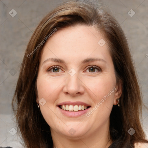 Joyful white adult female with medium  brown hair and brown eyes