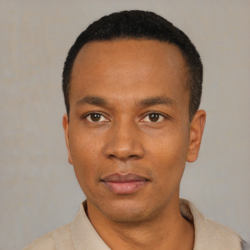 Neutral black young-adult male with short  black hair and brown eyes