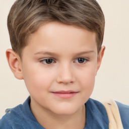 Joyful white child male with short  brown hair and brown eyes