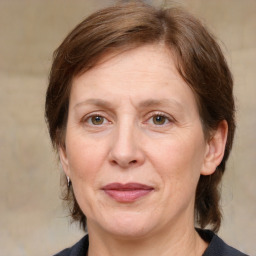 Joyful white adult female with medium  brown hair and grey eyes