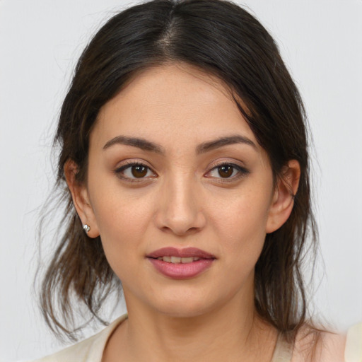 Joyful white young-adult female with medium  brown hair and brown eyes