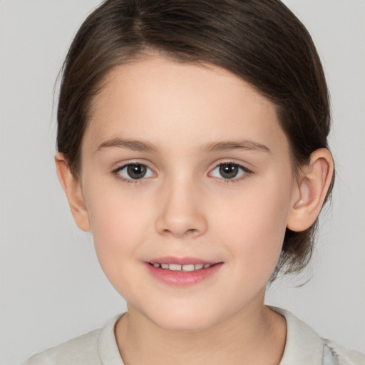 Joyful white child female with medium  brown hair and brown eyes