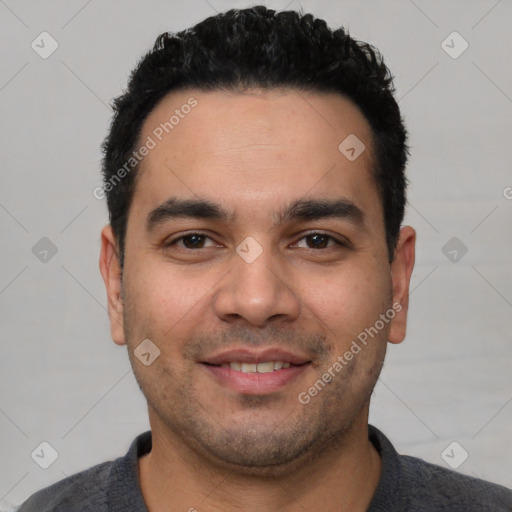 Joyful white young-adult male with short  black hair and brown eyes