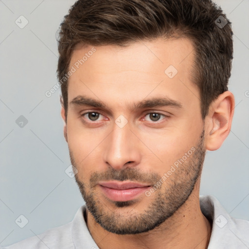 Neutral white young-adult male with short  brown hair and brown eyes