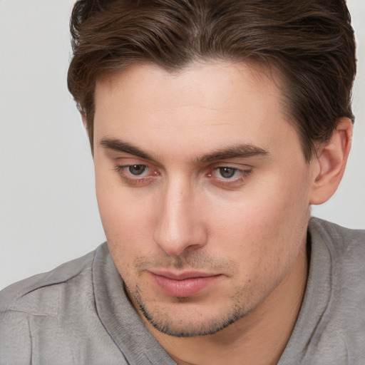 Neutral white young-adult male with short  brown hair and brown eyes