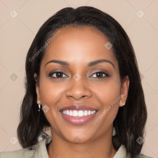 Joyful latino young-adult female with long  black hair and brown eyes