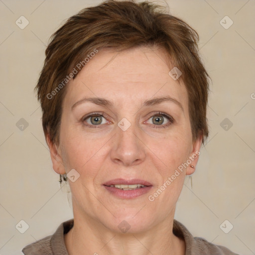 Joyful white adult female with short  brown hair and grey eyes