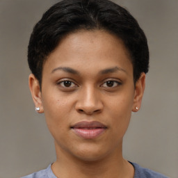 Joyful latino young-adult female with short  brown hair and brown eyes