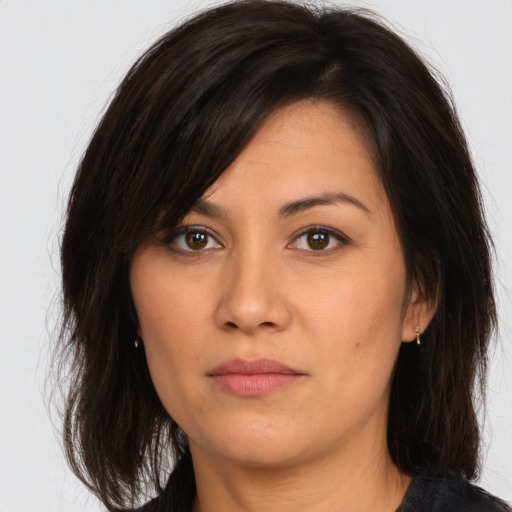 Joyful asian young-adult female with medium  brown hair and brown eyes