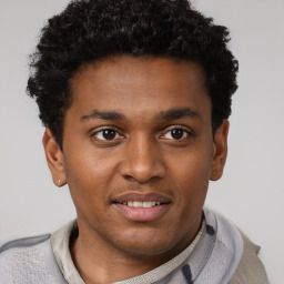 Joyful latino young-adult male with short  brown hair and brown eyes