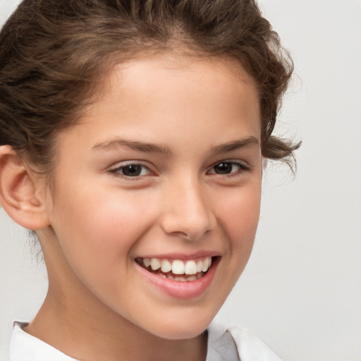 Joyful white child female with short  brown hair and brown eyes