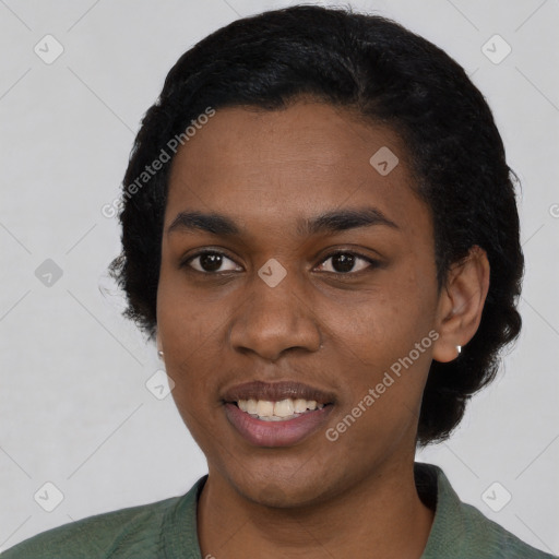 Joyful black young-adult female with short  black hair and brown eyes