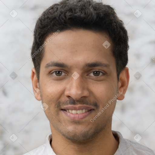 Joyful latino young-adult male with short  brown hair and brown eyes